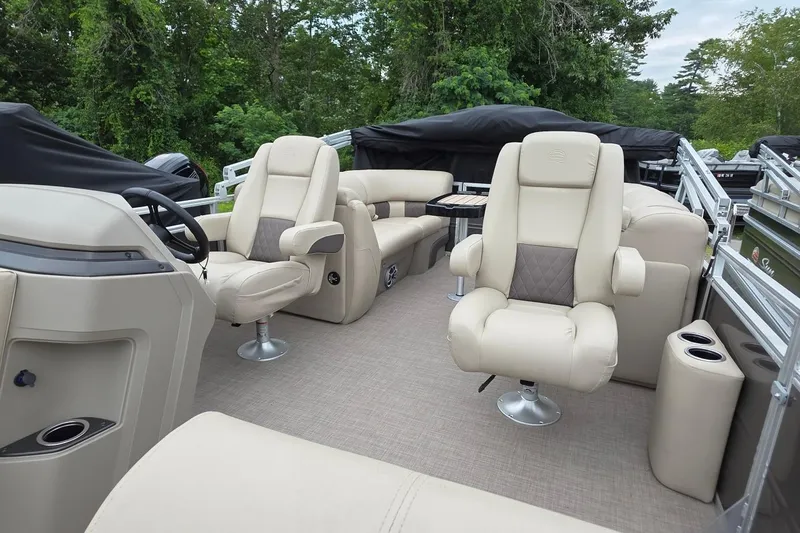 Slide: The Image of 2025 Sun Tracker PB 22 DLX pontoon boat interior with luxurious seating and modern design. - 10