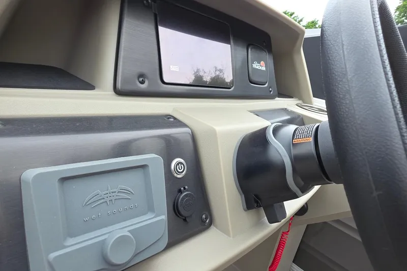 Slide: The Image of Dashboard of 2025 Sun Tracker PB 22 DLX boat with Wet Sounds audio system. - 4