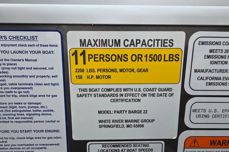 Slide: The Image of 2025 Sun Tracker PB 22 DLX capacity label: 11 persons or 1500 lbs, 150 HP motor. - 5