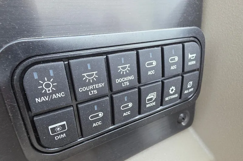 Slide: The Image of Control panel of 2025 Sun Tracker PB 22 DLX with various switches and buttons. - 6