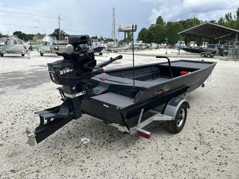 Slide: The Image of 2025 Gator Tail 1754 Extreme Series boat on trailer in outdoor setting. - 1