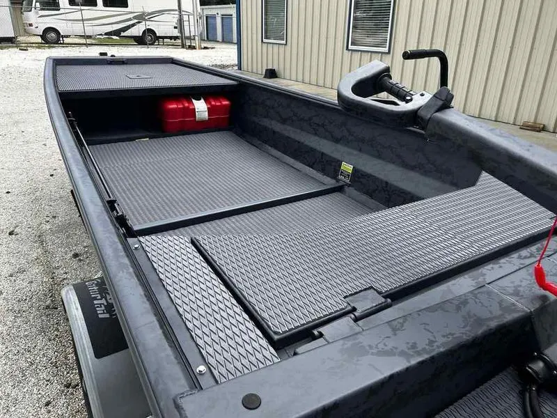 Slide: The Image of 2025 Gator Tail 1754 Extreme Series boat with textured flooring and storage compartments. - 7