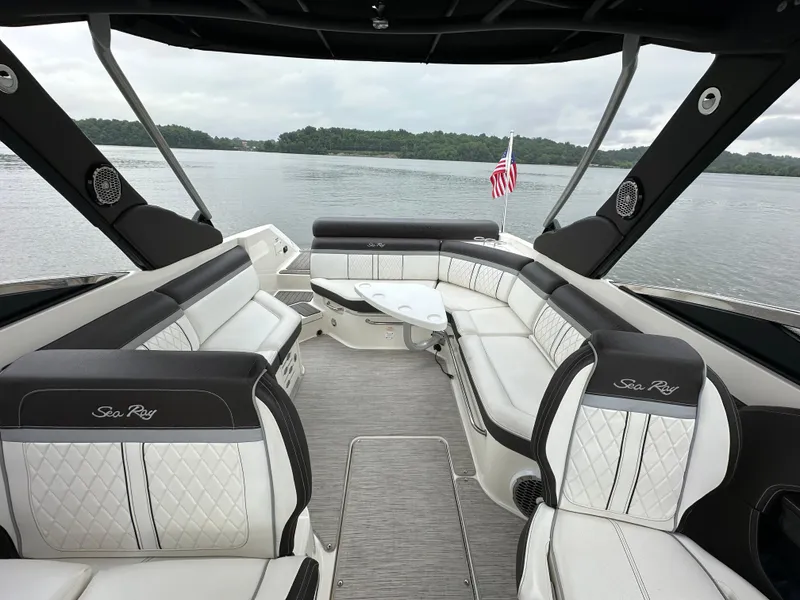 Slide: The Image of 2017 Sea Ray SLX 280 boat interior with luxurious seating and lake view. - 13
