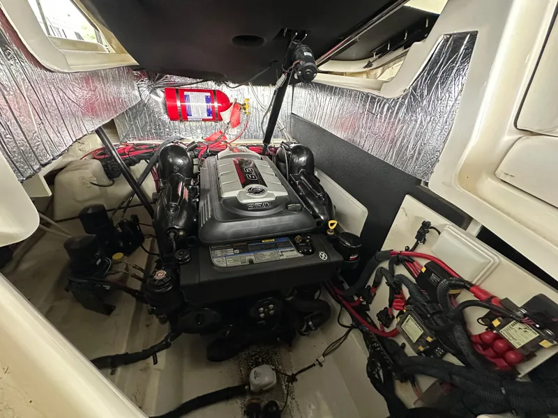 Slide: The Image of Engine compartment of a 2017 Sea Ray SLX 280 boat, featuring a well-organized layout. - 21