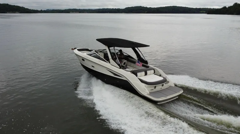 Slide: The Image of 2017 Sea Ray SLX 280 cruising on a calm lake with scenic background. - 3