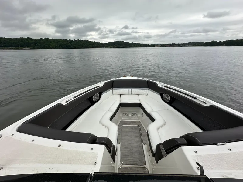 Slide: The Image of 2017 Sea Ray SLX 280 boat interior with lake view, featuring sleek seating and overcast sky. - 9