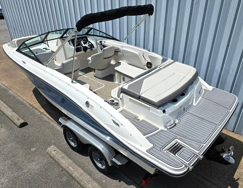 Slide: The Image of 2020 Sea Ray SPX 210 boat on trailer, featuring sleek design and spacious seating. - 2