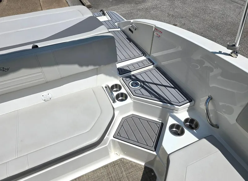 Slide: The Image of 2020 Sea Ray SPX 210 boat interior with seating and cup holders. - 7