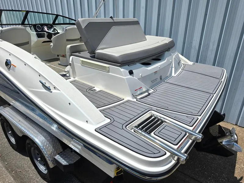 Slide: The Image of 2020 Sea Ray SPX 210 boat with spacious deck and modern design. - 8