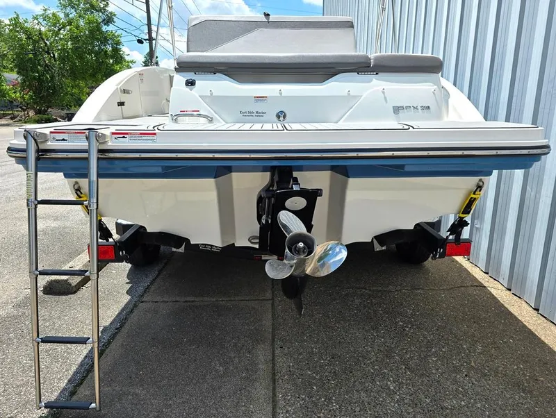 Slide: The Image of 2020 Sea Ray SPX 210 boat rear view with ladder and propeller. - 9