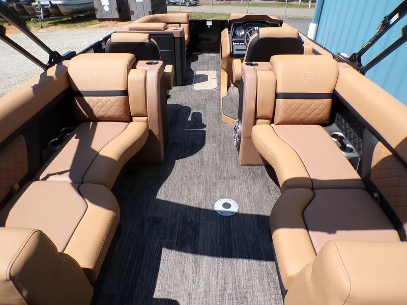 Slide: The Image of Luxurious interior of 2025 Godfrey AquaPatio 235 SBC pontoon boat with tan seating. - 11