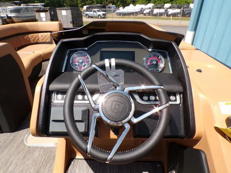Slide: The Image of Steering console of 2025 Godfrey AquaPatio 235 SBC iMPACT pontoon boat. - 3