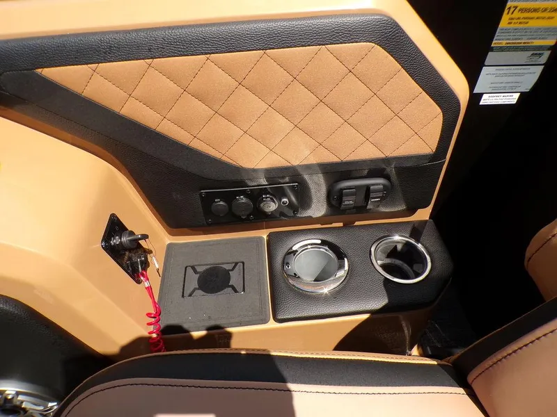 Slide: The Image of Interior of 2025 Godfrey AquaPatio 235 SBC with cup holders and control panel. - 4