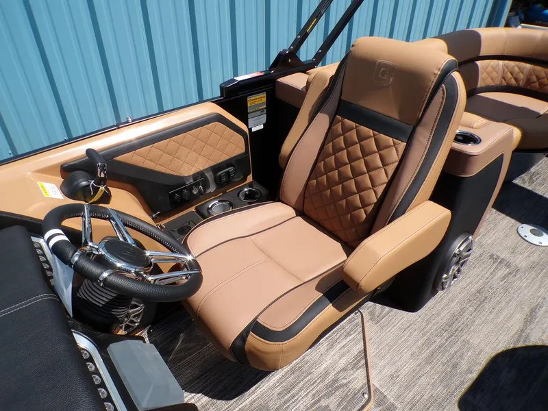 Slide: The Image of Luxurious interior of 2025 Godfrey AquaPatio 235 SBC boat with tan leather seating. - 5