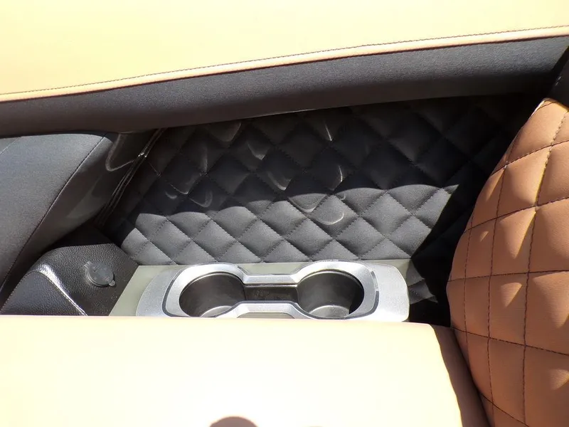 Slide: The Image of Luxurious interior of 2025 Godfrey AquaPatio 235 SBC with quilted leather and cup holders. - 9