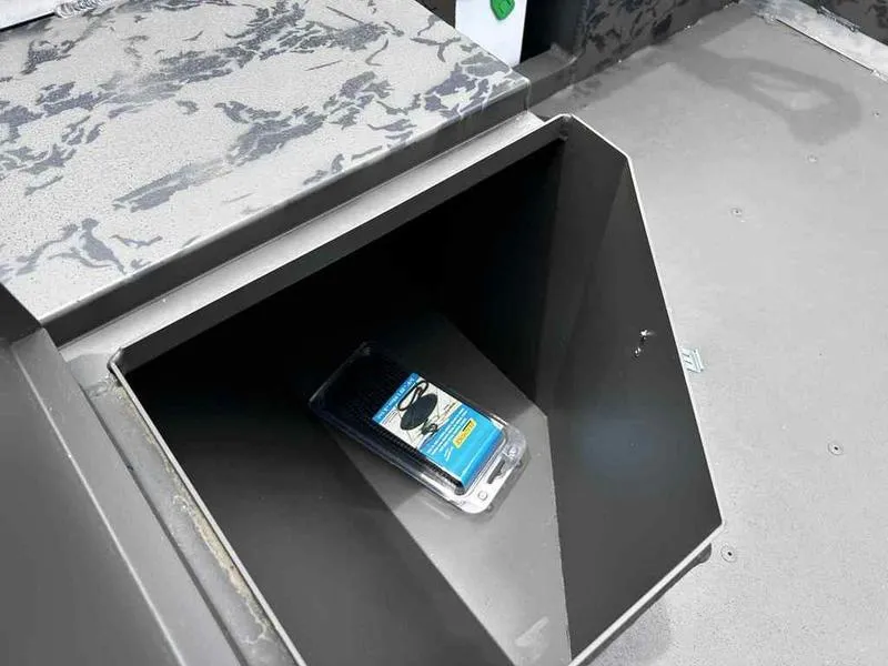 Slide: The Image of Open storage compartment in 2025 Gator Tail 1748 Gator Series boat. - 10