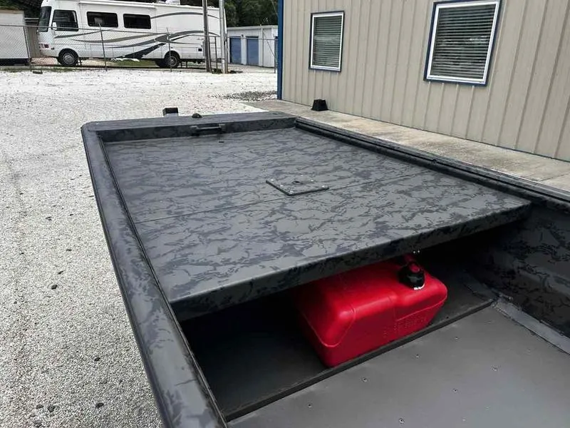 Slide: The Image of 2025 Gator Tail 1748 Gator Series boat with storage compartment and red fuel tank. - 11