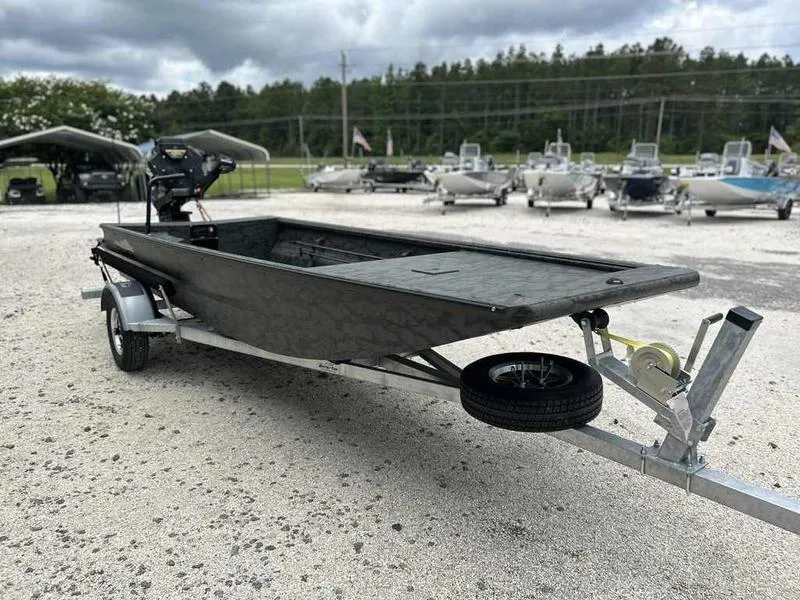 Slide: The Image of 2025 Gator Tail 1748 Gator Series boat on trailer, parked outdoors. - 2