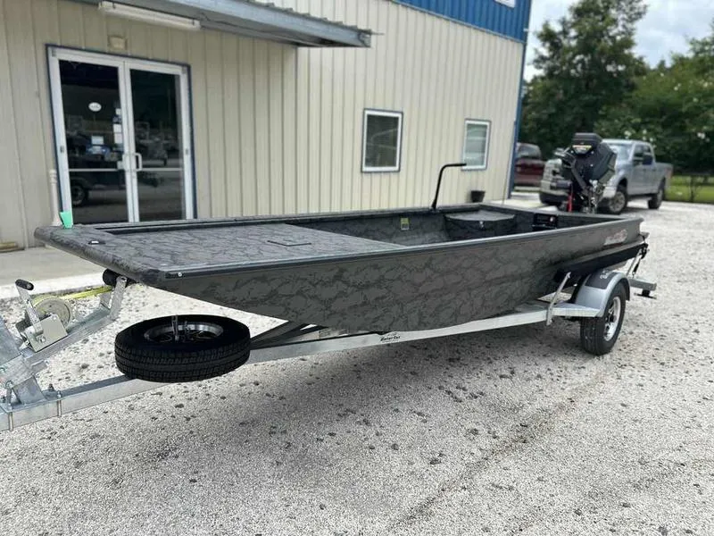 Slide: The Image of 2025 Gator Tail 1748 Gator Series boat on trailer outside a building. - 3