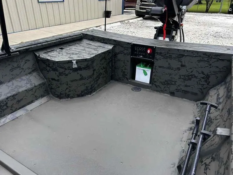 Slide: The Image of 2025 Gator Tail 1748 Gator Series boat interior with camouflage design and storage compartments. - 8