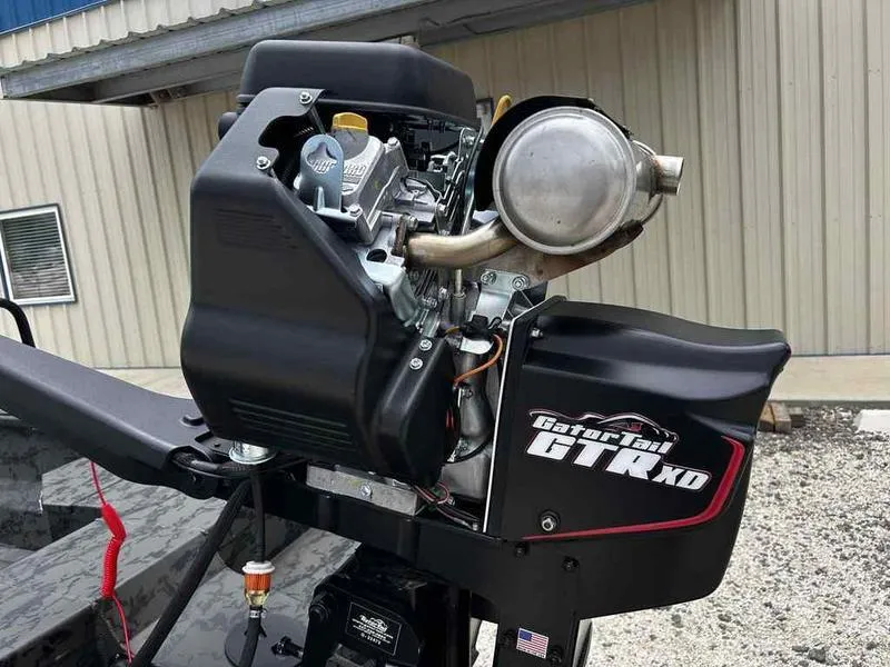 Slide: The Image of 2025 Gator Tail 1748 Gator Series outboard motor, detailed view, mounted on a boat. - 9