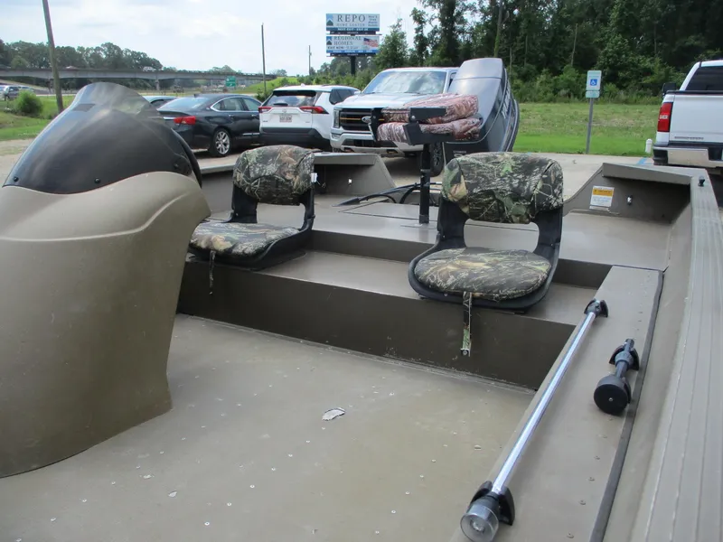 Slide: The Image of Fishing boat interior with camouflage seats, steering console, and rod holder, G3 1966 SC model. - 10