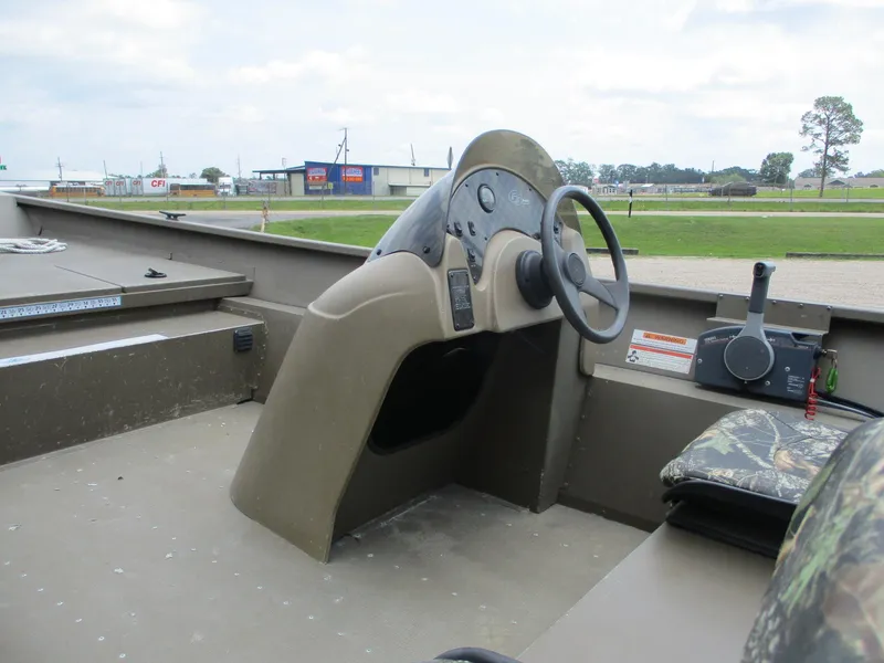 Slide: The Image of Steering console of a 2010 G3 1966 SC boat, featuring a simple design. - 12