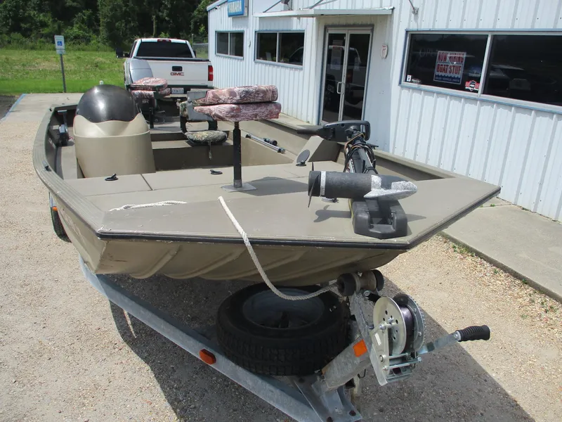 Slide: The Image of Fishing boat on trailer outside a building, G3 1966 SC model, year 2010. - 2