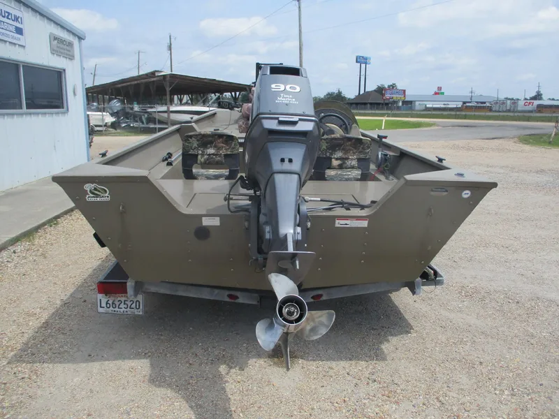 Slide: The Image of Rear view of a 2010 G3 1966 SC boat with a 90 HP motor. - 3