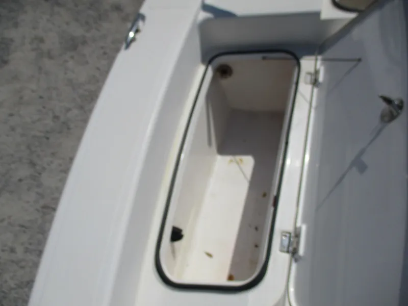 Slide: The Image of Open storage compartment on a 2010 BlackJack 224 boat. - 10