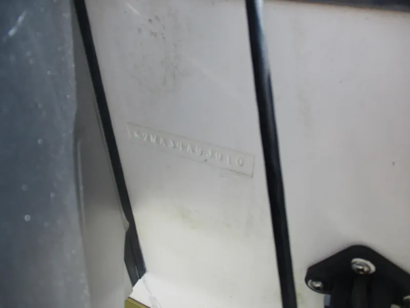 Slide: The Image of Close-up of a 2010 BlackJack 224 boat hull identification number. - 13