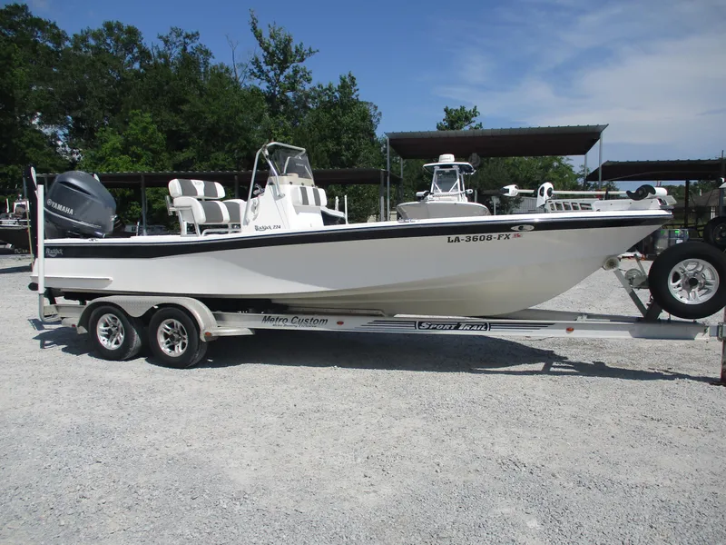 Slide: The Image of 2010 BlackJack 224 boat on trailer, parked outdoors, with Yamaha engine. - 4