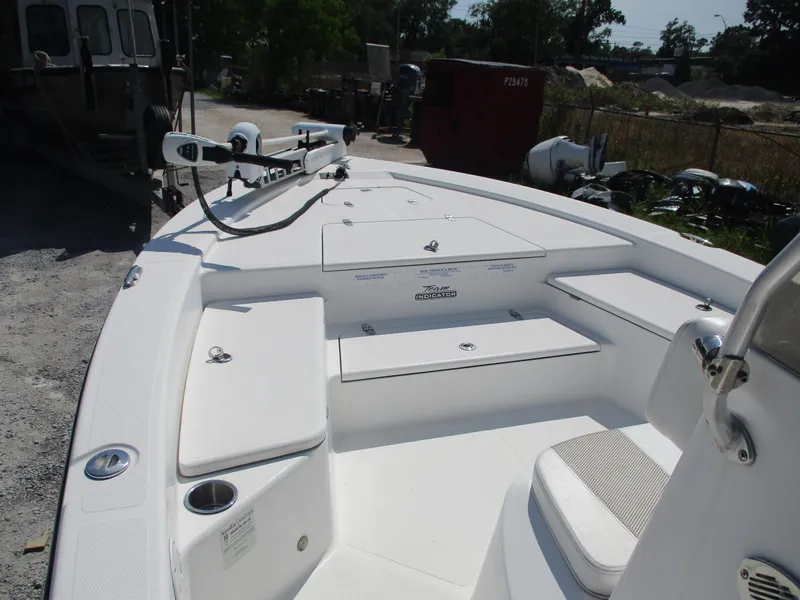 Slide: The Image of 2010 BlackJack 224 boat interior with seating and storage compartments. - 7