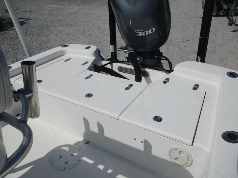 Slide: The Image of 2010 BlackJack 224 boat with Yamaha 300 engine, featuring spacious deck and storage compartments. - 8