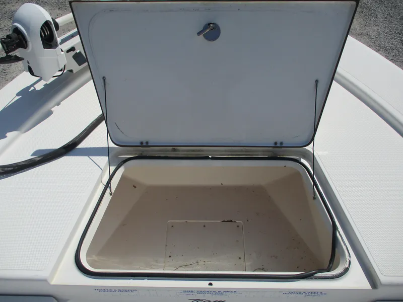 Slide: The Image of Open storage compartment on a 2010 BlackJack 224 boat deck. - 9
