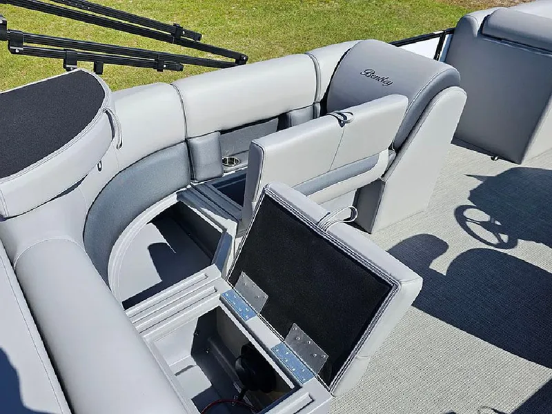 Slide: The Image of 2025 Bentley Pontoons Legacy 243 Cruise Tritoon interior with plush seating and modern helm. - 12