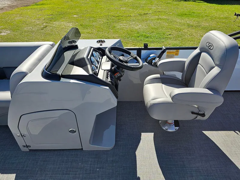 Slide: The Image of 2025 Bentley Pontoons Legacy 243 Cruise Tritoon with luxurious gray seating and spacious layout. - 14