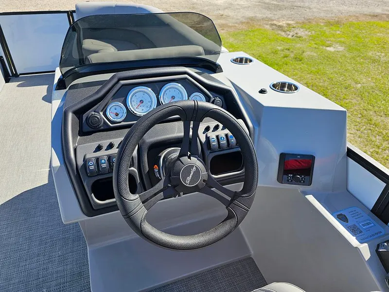 Slide: The Image of 2025 Bentley Pontoons Legacy 243 Cruise Tritoon with open storage compartment on deck. - 16