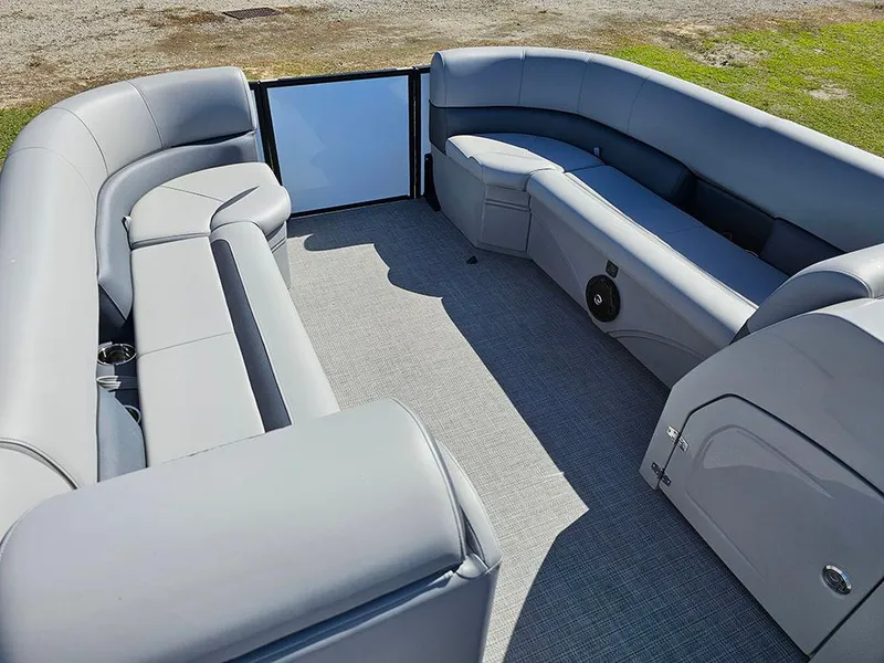 Slide: The Image of 2025 Bentley Pontoons Legacy 243 Cruise Tritoon storage compartment with open door on deck. - 18