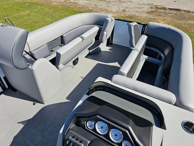 Slide: The Image of 2025 Bentley Pontoons Legacy 243 Cruise Tritoon dashboard with steering wheel and gauges. - 19