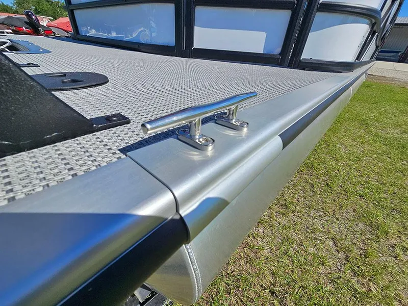 Slide: The Image of 2025 Bentley Pontoons Legacy 243 Cruise Tritoon with red canopy, docked outdoors. - 25