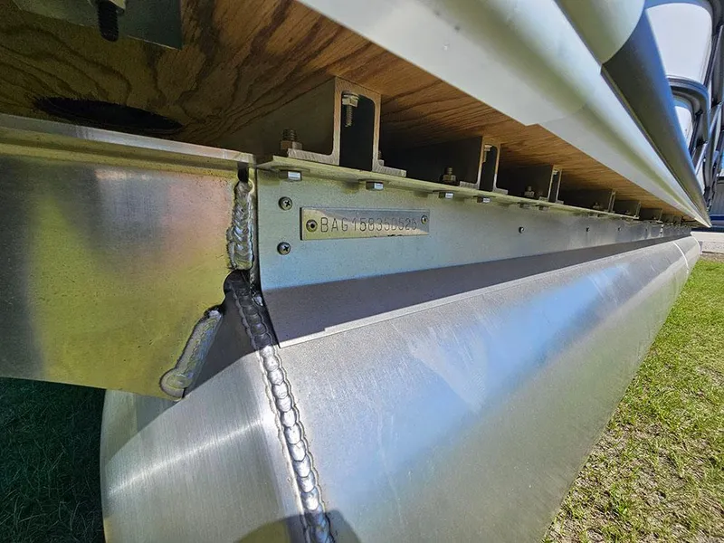 Slide: The Image of 2025 Bentley Pontoons Legacy 243 Cruise Tritoon underside, showcasing sturdy construction and craftsmanship. - 29