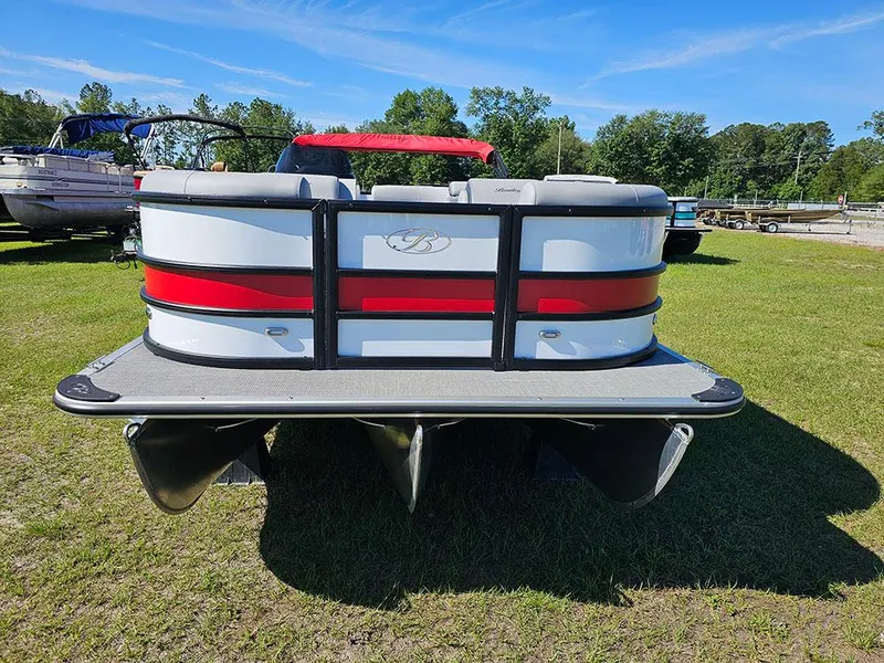 Slide: The Image of 2025 Bentley Pontoons Legacy 243 Cruise Tritoon on grass under clear blue sky. - 4