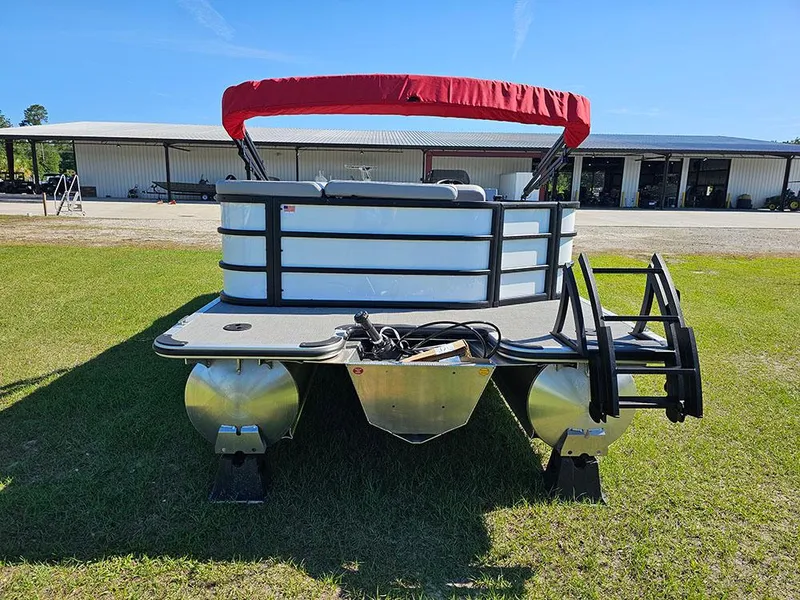 Slide: The Image of 2025 Bentley Pontoons Legacy 243 Cruise Tritoon on grass under clear blue sky. - 8