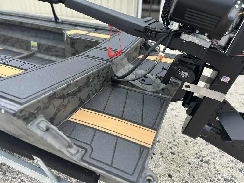 Slide: The Image of 2025 Gator Tail EXTREME MOD-V 1854 boat interior with motor and textured flooring. - 11