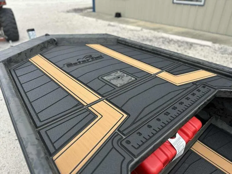 Slide: The Image of 2025 Gator Tail EXTREME MOD-V 1854 boat deck with custom design and ruler markings. - 12