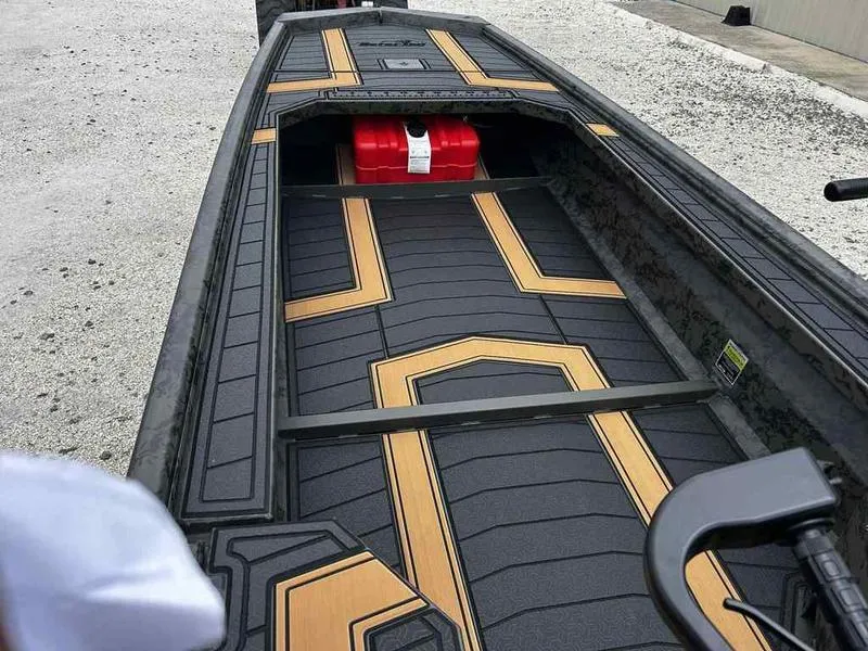 Slide: The Image of 2025 Gator Tail EXTREME MOD-V 1854 boat interior with modern design and red fuel tank. - 13