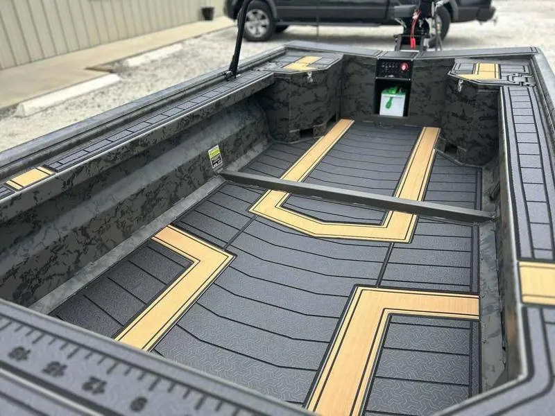 Slide: The Image of 2025 Gator Tail EXTREME MOD-V 1854 boat interior with sleek, modern design and durable flooring. - 14