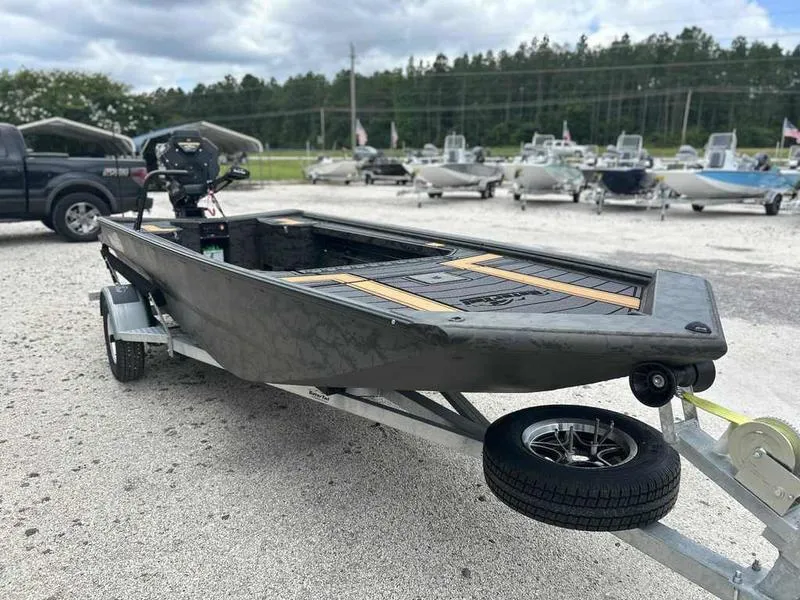 Slide: The Image of 2025 Gator Tail EXTREME MOD-V 1854 boat on trailer, parked outdoors. - 5