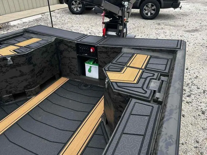 Slide: The Image of 2025 Gator Tail EXTREME MOD-V 1854 boat interior with sleek design and storage compartments. - 7